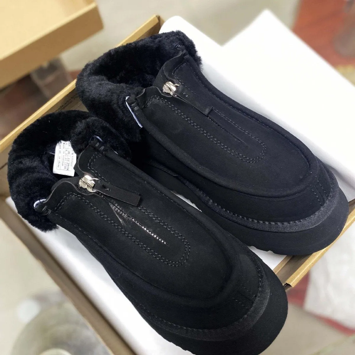 Front-zip shearling one-piece snow boots
