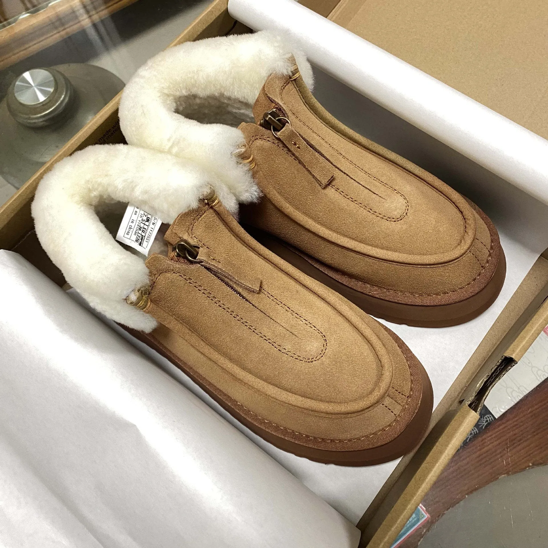 Front-zip shearling one-piece snow boots